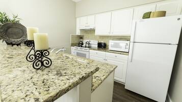 Microwave, dishwasher, coffee/tea maker, cookware/dishes/utensils