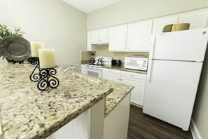 Microwave, dishwasher, coffee/tea maker, cookware/dishes/utensils