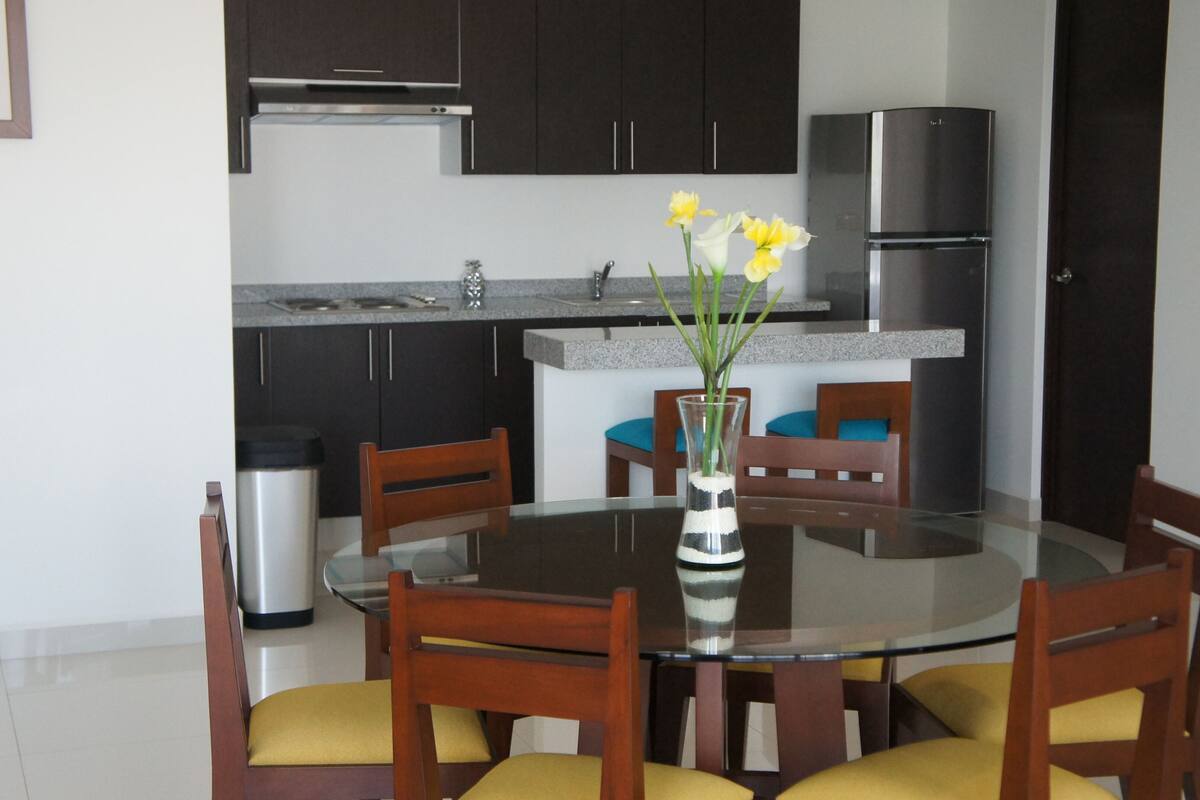 luxury suite | private kitchenette | full-sized fridge, dishwasher, griddle, cookware/dishes/utensils