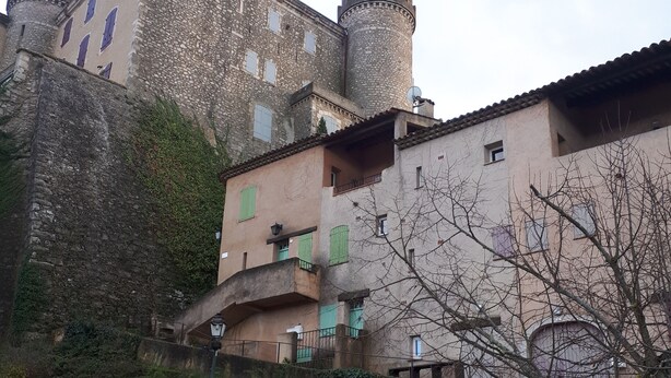 A historic building with a stone tower and multiple windows. - For nature lovers (SAINT MARTIN DE PALLIERES)