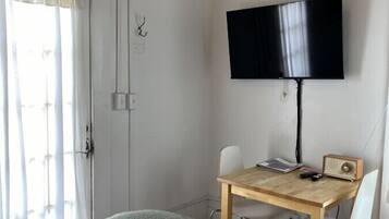 1 bedroom, desk, iron/ironing board, travel crib