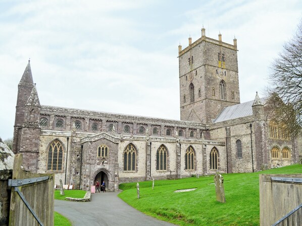 A historic church with a tall tower and arched windows.