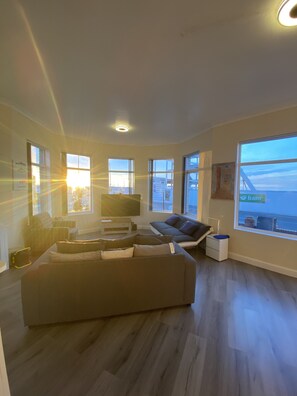 Deluxe Apartment, 1 Bedroom, Beach View, Beachfront | Living area | 60-inch LED TV with digital channels, TV, Netflix