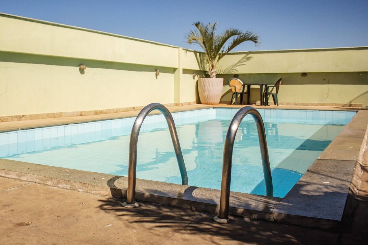 Outdoor pool, open 8:00 AM to 8:00 PM, pool loungers