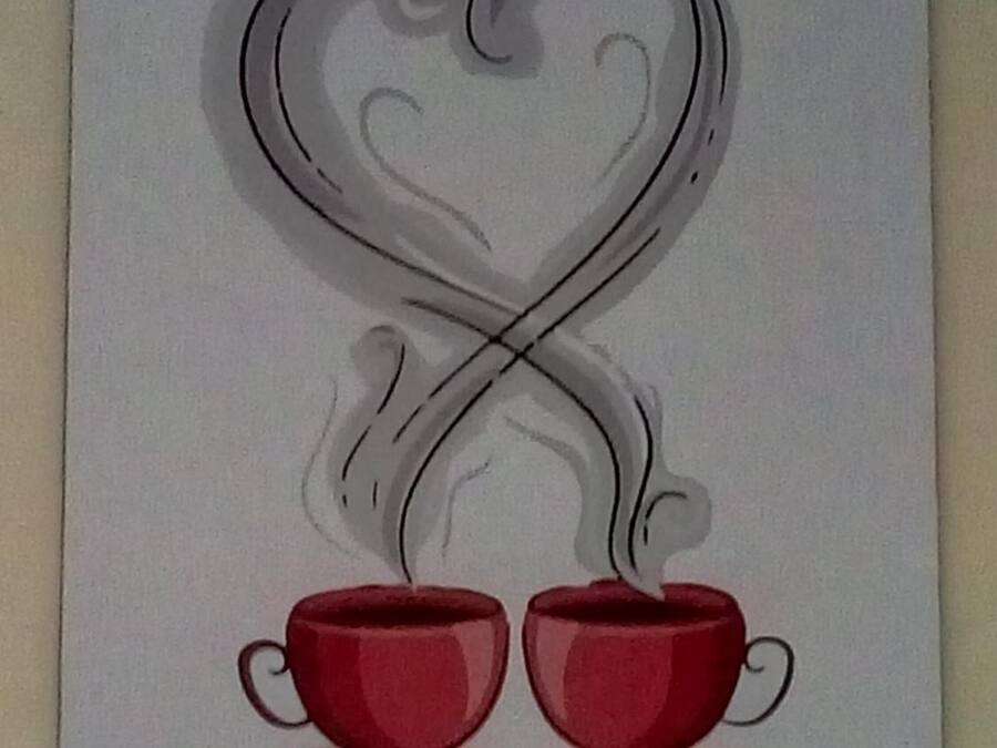 A framed artwork of two red cups with steam rising from them, forming a heart shape above.