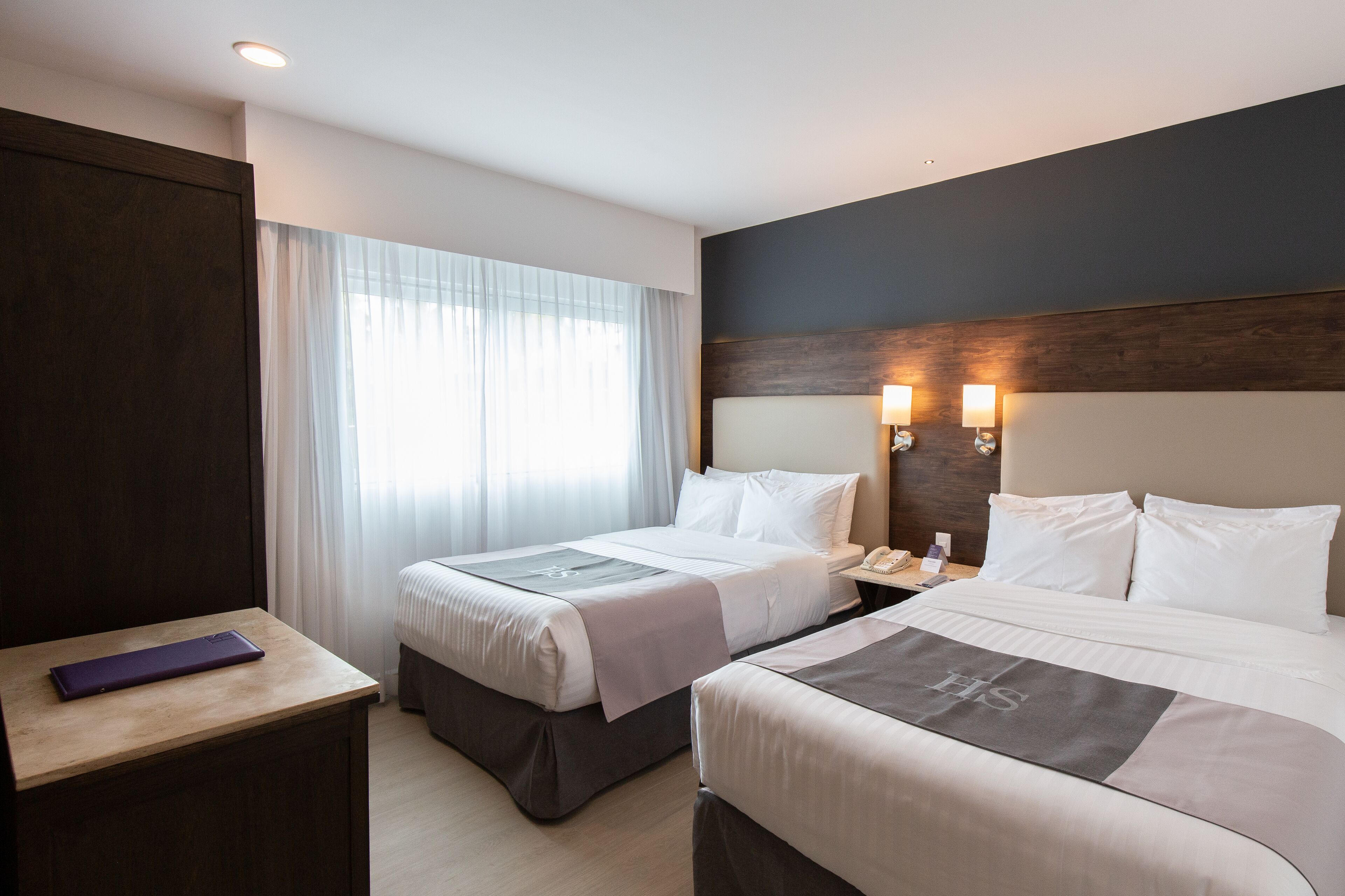 junior double room, 2 double beds | premium bedding, down duvets, in-room safe, desk