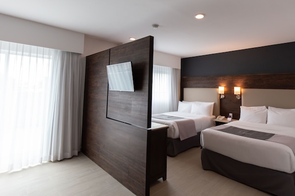 Premium bedding, down duvets, in-room safe, desk