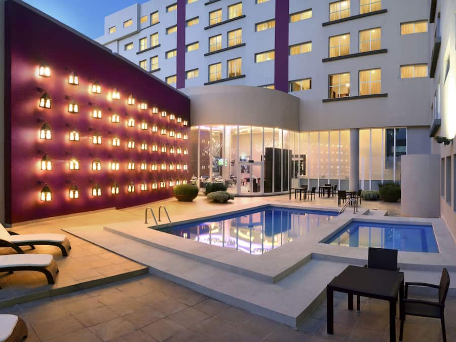 Outdoor pool, open 8:00 AM to 8:00 PM, pool loungers