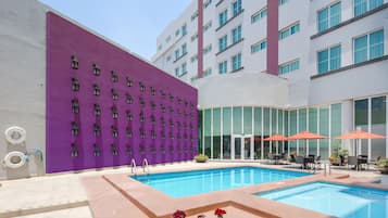 Outdoor pool, open 8:00 AM to 8:00 PM, sun loungers