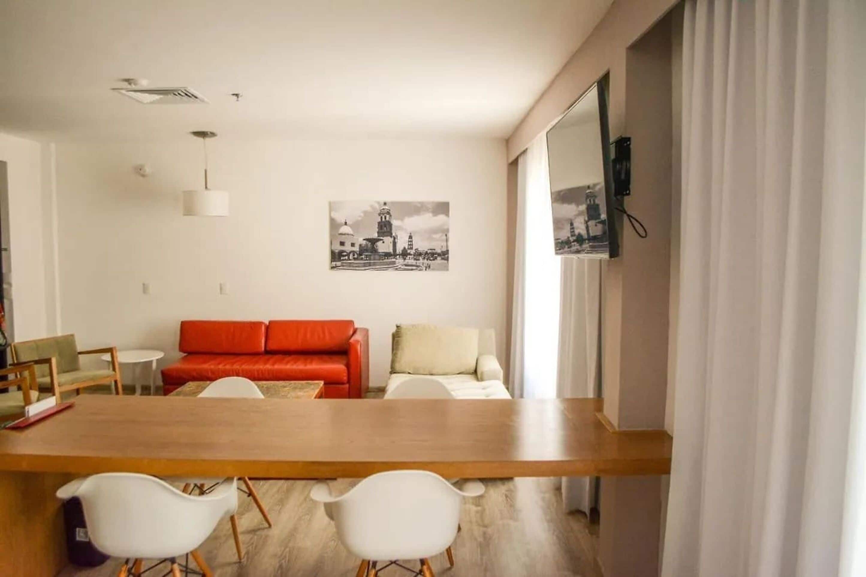 Junior Suite, 1 King Bed | Living area | 32-inch Smart TV with cable channels, TV