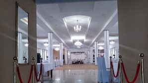 A spacious, well-lit hallway with a polished floor, leading to a decorated event space. - Hotel Zlotogorski (gmina Koscielec)