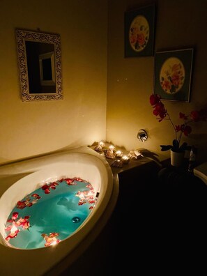 Separate tub and shower, rainfall showerhead, designer toiletries