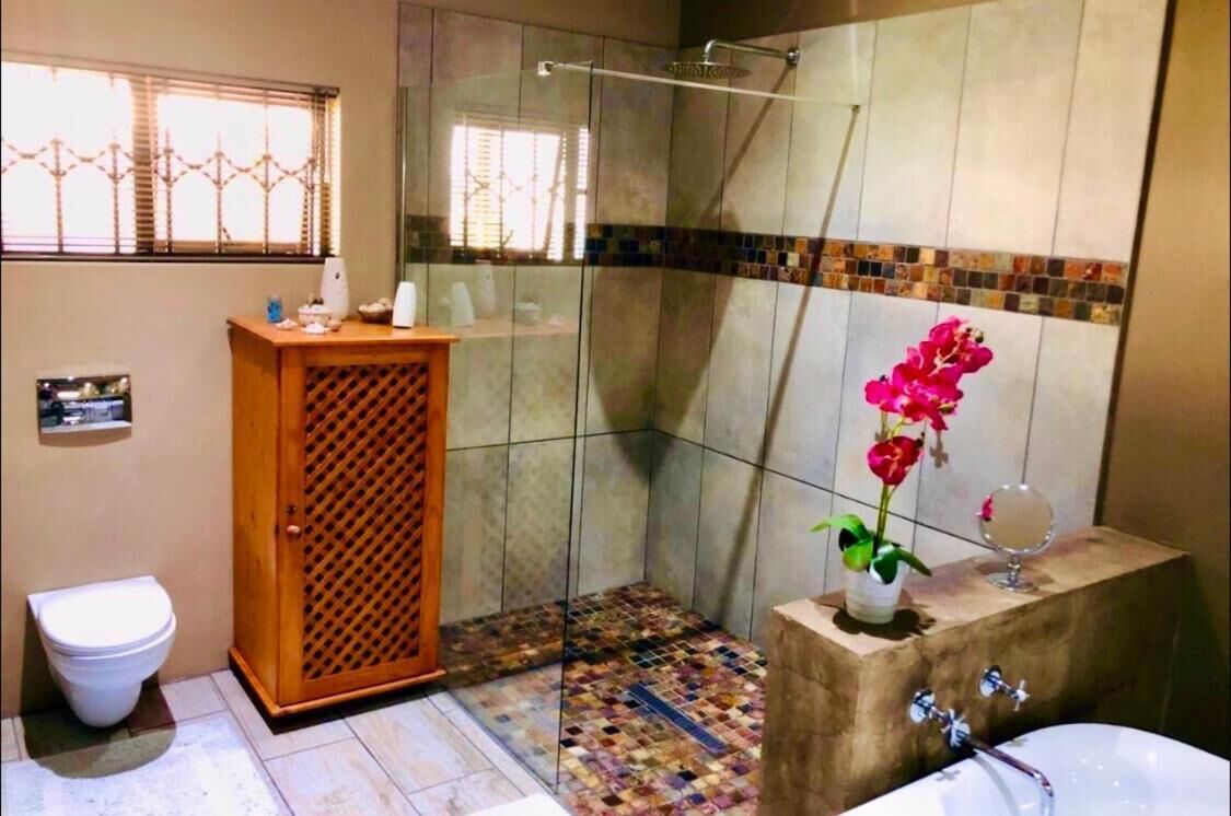 Separate bathtub and shower, rainfall showerhead, designer toiletries