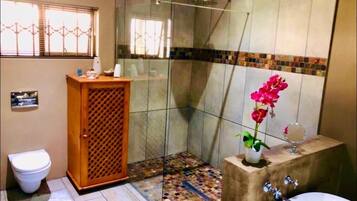 Separate bathtub and shower, rainfall showerhead, designer toiletries