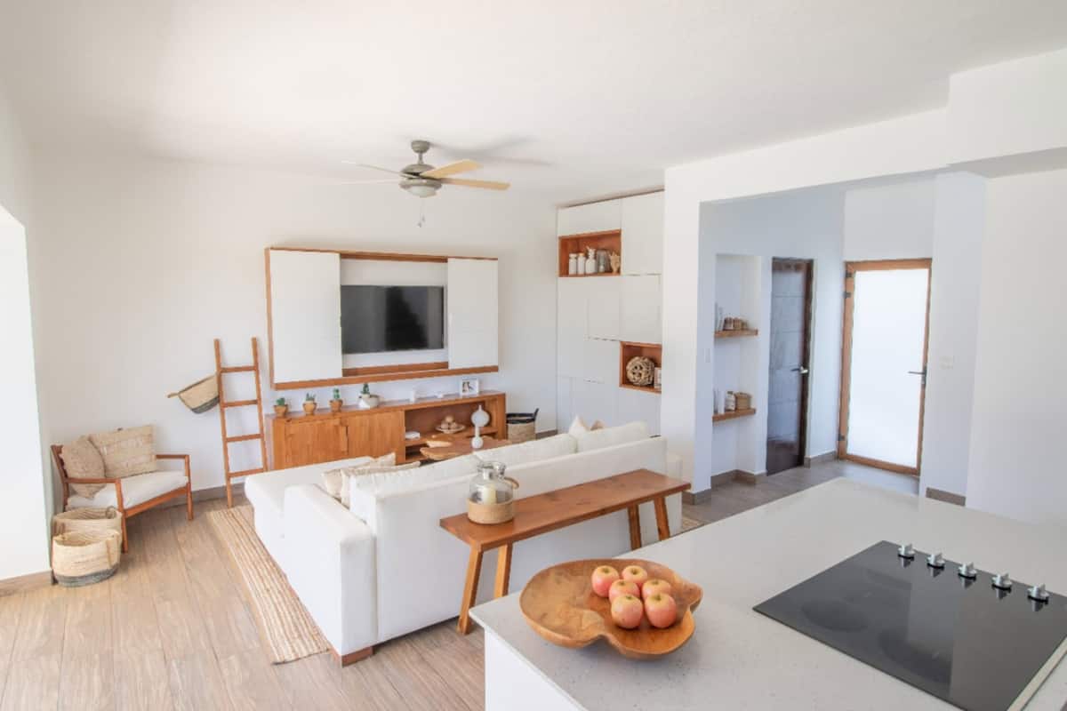 full-sized fridge, microwave, stovetop, coffee/tea maker