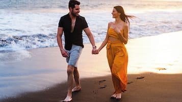 Private beach, black sand, beach towels, beach volleyball