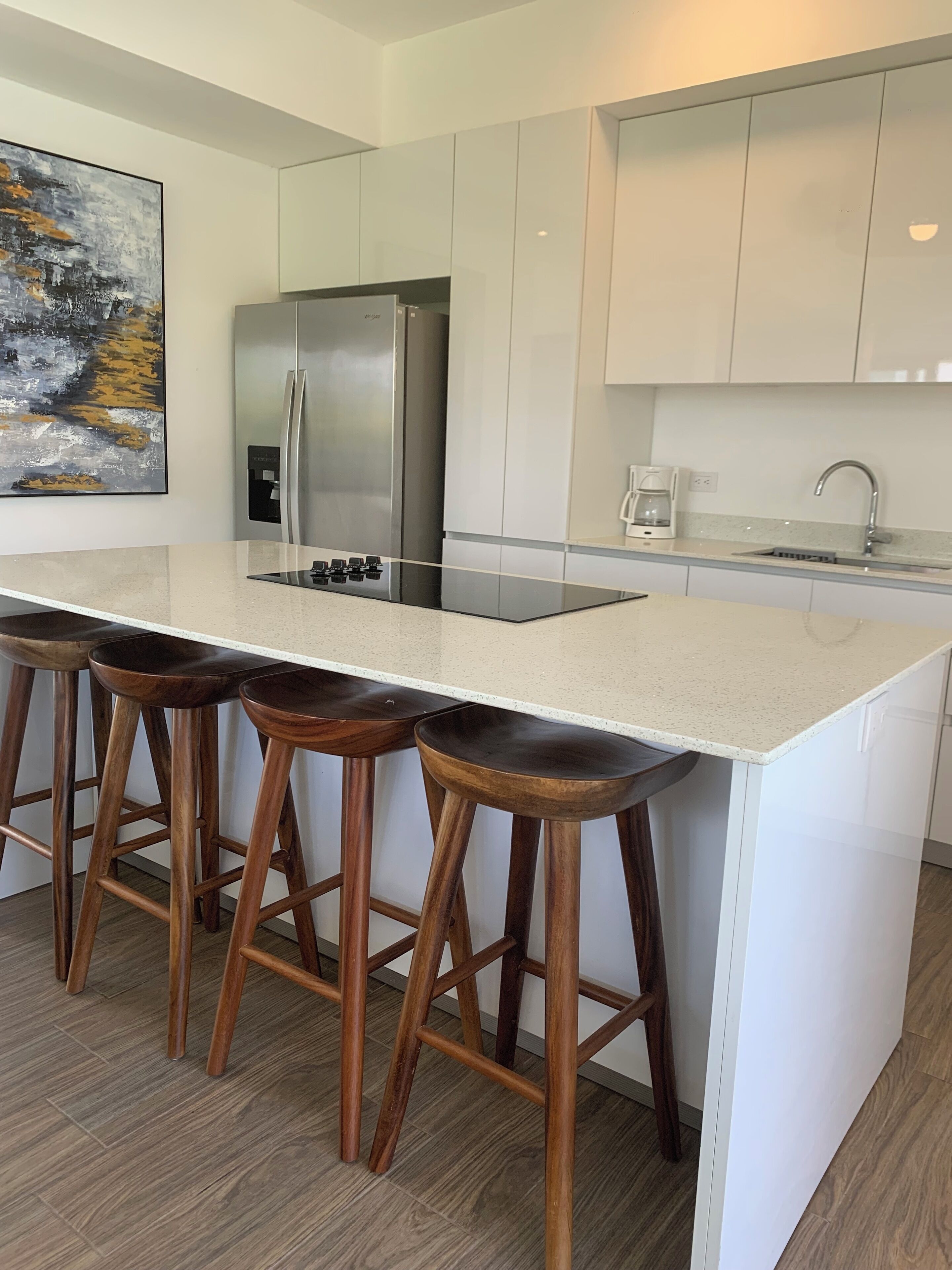 full-sized fridge, microwave, stovetop, coffee/tea maker