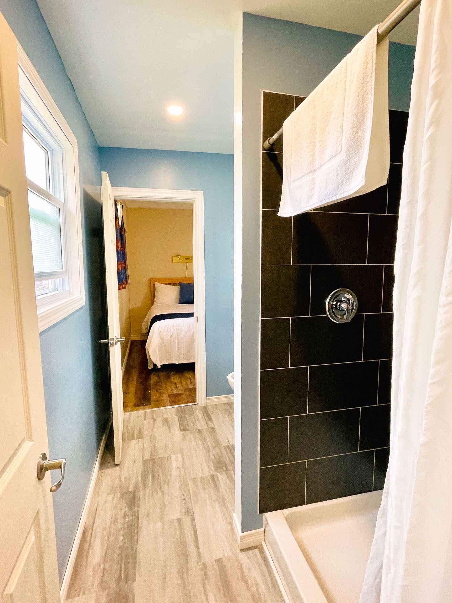 A bathroom with a shower, a bathtub, and a toilet.