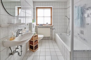 Bathtub, hair dryer, towels