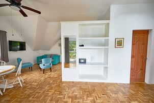 Attic Studio, Balcony | Living area | 40-inch flat-screen TV with cable channels, TV