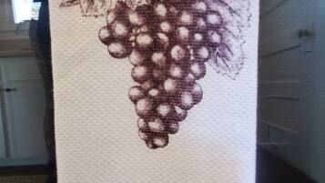 A towel with a grapevine illustration and the text 'SANTA ROSA Sonoma Wine Country'.