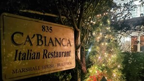 A sign for the Ca' Bianca Italian Restaurant, located at 835 Marshall House, built in 1876.
