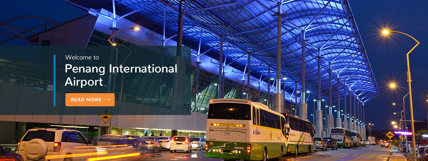 An airport terminal with a modern design, featuring a large glass facade and a distinctive roof structure.