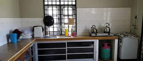 Fridge, electric kettle, dining tables