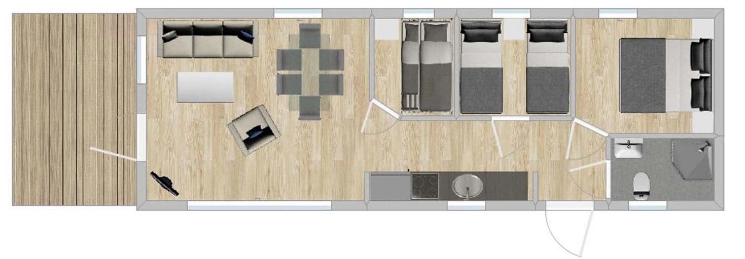 A hotel room layout with a living area, a dining area, a kitchen, a bathroom, and a small balcony.