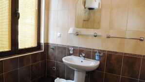 Shower, towels, soap, toilet paper
