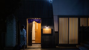 A hotel entrance with a sign reading "OTERA STAY TEMPLE HOTEL SHODENJI". - Temple Hotel Shoden-ji (Tokyo)