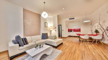 Royal Apartment, 1 Bedroom, Hot Tub | Living area | 42-inch LCD TV with cable channels, TV