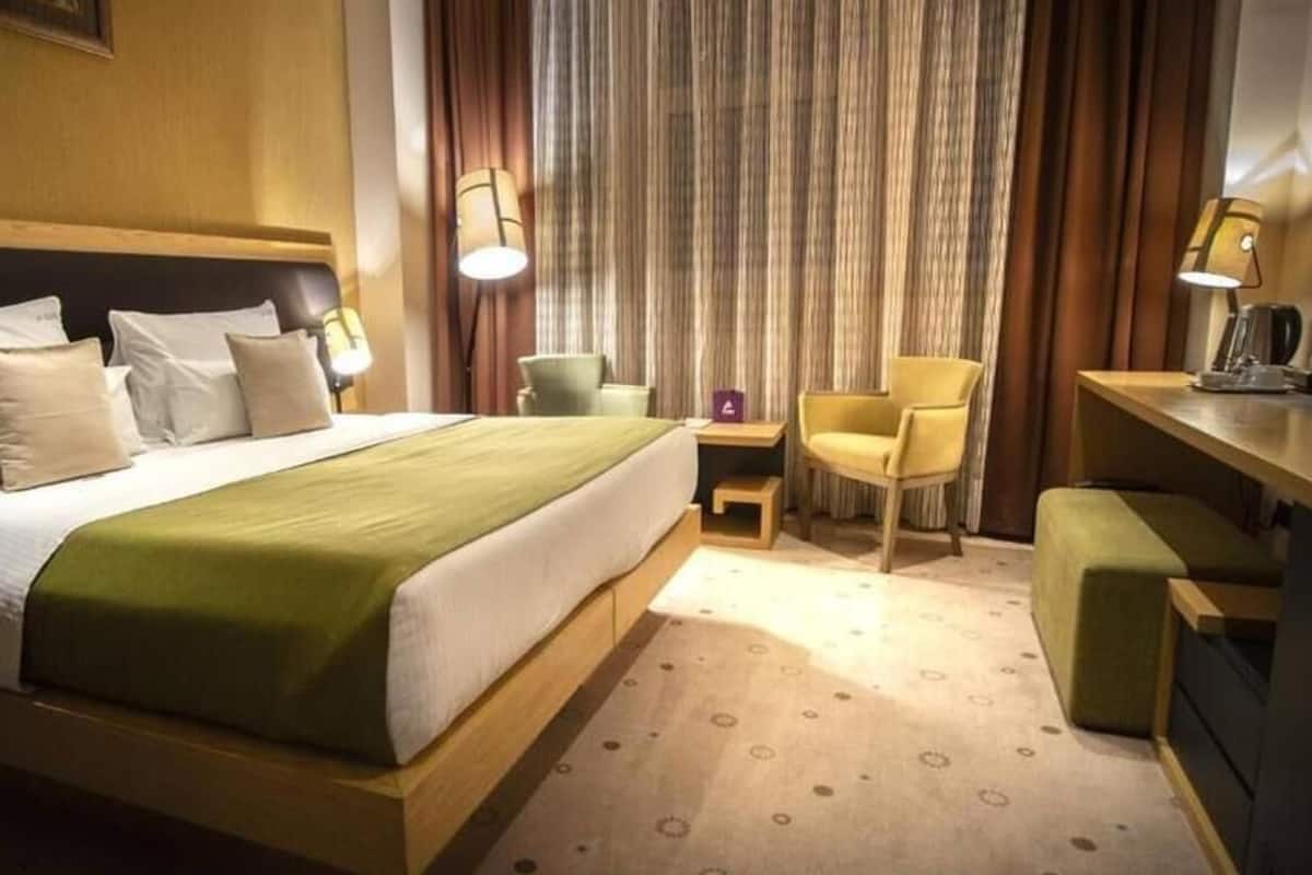 Chambre Deluxe Double ou avec lits jumeaux | Draps en coton égyptien, literie de qualité supérieure, minibar