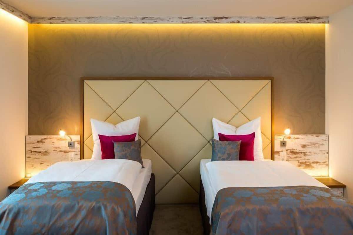 Chambre Deluxe double ou avec lits jumeaux | Literie hypoallergénique, minibar, coffre-fort, bureau