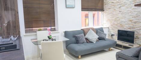 Apartment, 1 Bedroom (Flat 1) | Living area | Flat-screen TV