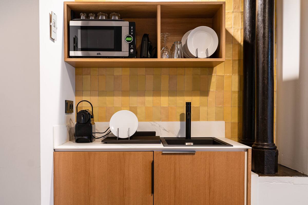 design studio suite | private kitchen | full-sized fridge, microwave, coffee/tea maker, cookware/dishes/utensils