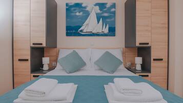 Apartment, 2 Bedrooms, Balcony, Sea View | 1 bedroom, iron/ironing board, free WiFi, bed sheets