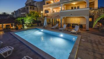Seasonal outdoor pool, open 9:00 AM to 9:00 PM, pool umbrellas