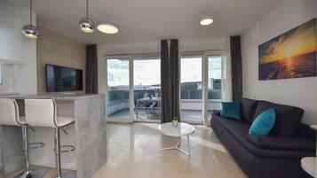 Deluxe Apartment, 3 Bedrooms, Non Smoking, Terrace | Living area | 45-inch flat-screen TV with satellite channels, TV