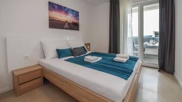Appartamento Deluxe, 3 camere da letto, non fumatori, terrazzo | Una cassaforte in camera, ferro/asse da stiro, Wi-Fi gratuito, lenzuola