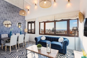 Apartment (4 Bedrooms) | Living room | 32-inch TV with cable channels