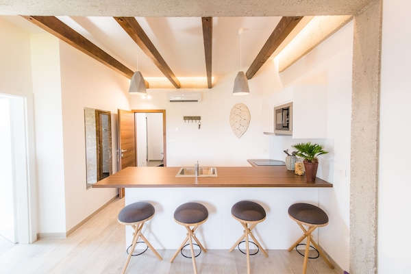 Deluxe Apartment | Living area | 70-cm LCD TV with satellite channels, TV