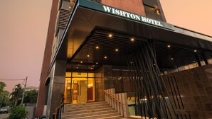 A modern hotel entrance with a prominent sign reading "WISHTON HOTEL". - Wishton Hotel Yangon (Yangon)
