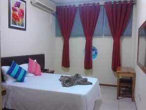 Down duvets, desk, laptop workspace, blackout curtains