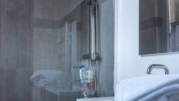 Combined shower/tub, hair dryer, towels, soap