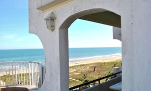 Enjoy breathtaking ocean views from this balcony with a table for al fresco dining.