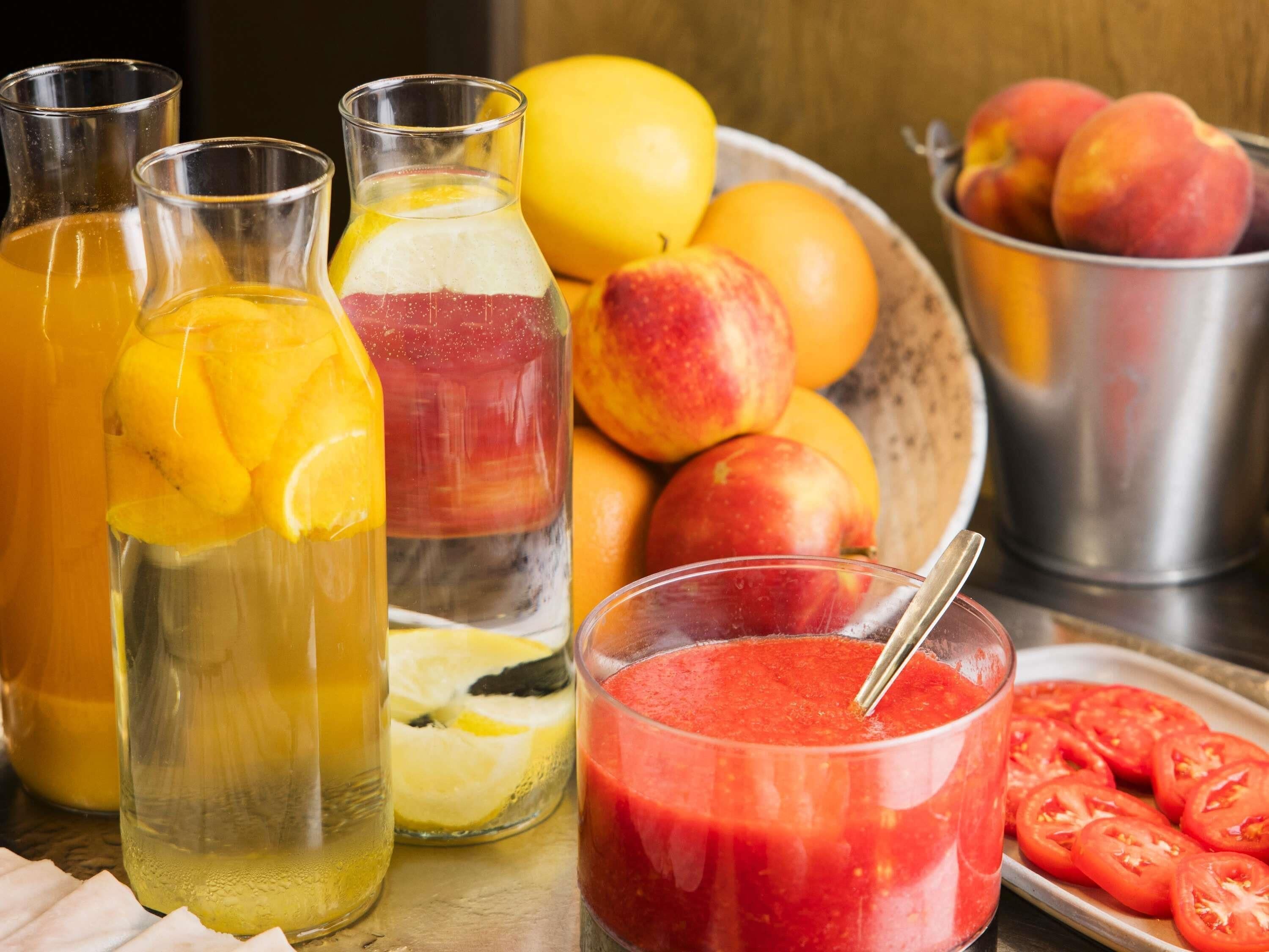 A variety of fruits and beverages, including peaches, oranges, and tomatoes, suggesting a focus on fresh produce.