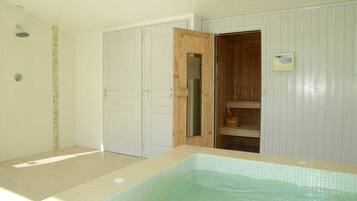 Relax by the rectangular pool, surrounded by a tranquil atmosphere.