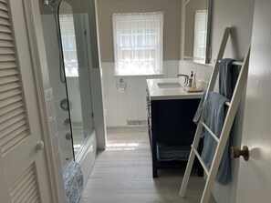 Bathtub, hair dryer, towels