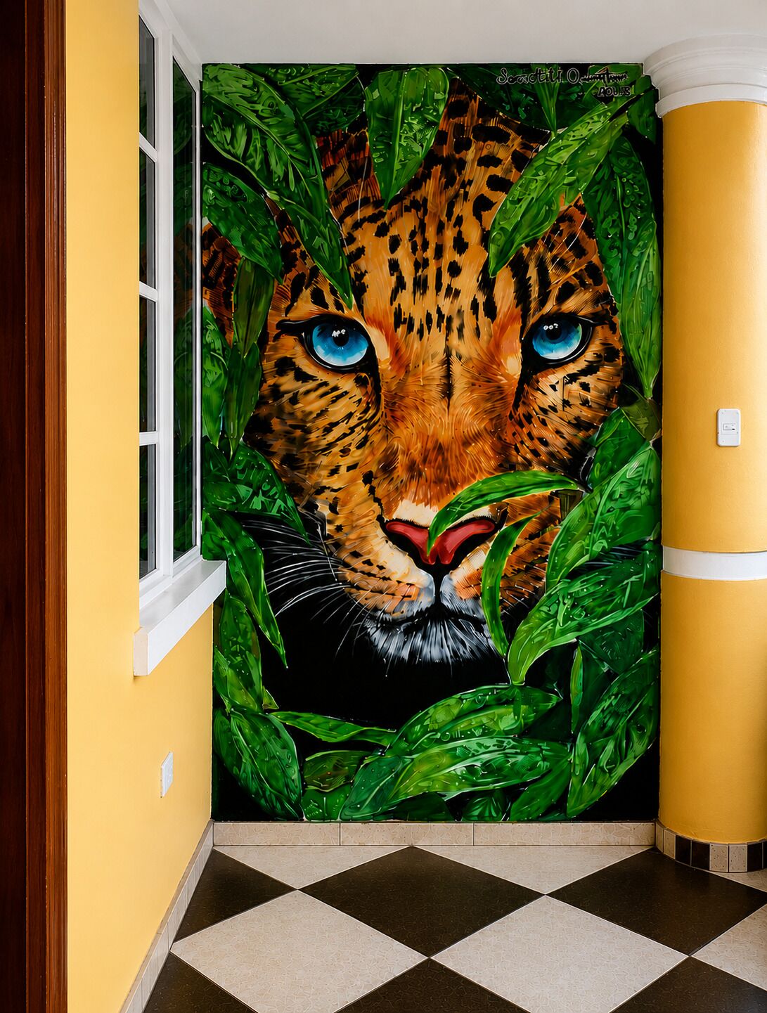 A hallway with a large, realistic painting of a leopard's face peeking through foliage.